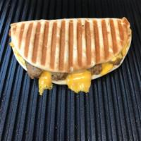 Breakfast grilled panini Sandwich · Egg, Tillamook cheese and Turkey Sausage.