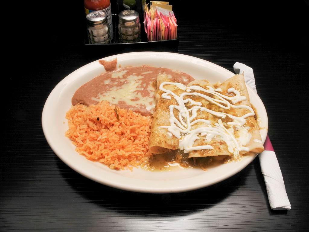 Enchiladas Verdes · 3 enchiladas, 1 chicken, 1 cheese and 1 shredded beef. All topped with a special green tomatillo sauce and sour cream. Served with rice and beans.