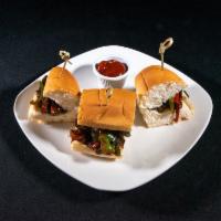 Pepper Steak Sliders · Served with a Cajun ketchup on the side.
