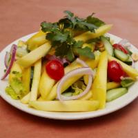 Mango Salad · Mango, onion, romaine lettuce, peanuts and cherry tomatoes with Thai vinaigrette.
