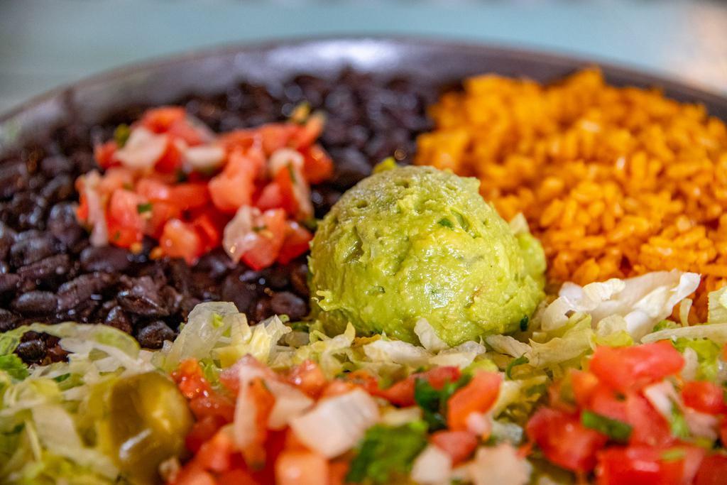 Peasant Plate · Baja rice, black or pinto beans and guacamole salad (shredded lettuce, pico de gallo and guacamole). Comes with chips or tortillas. Vegetarian.