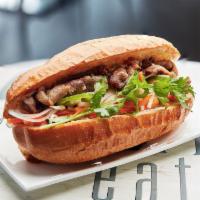 Beef Banh Mi  · Sandwich with lemongrass beef, pickled vegetables, cucumber, onions, jalapeño, cilantro on b...