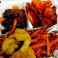 11. Buffalo Wings, Ribs and Shrimp · Seved with fries, 6 wings, 3 ribs and3 shrimp.