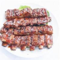 Baby Back Ribs · Lean and tender. 12-14 ribs. 
