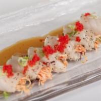 Seared Ahi Albacore Tuna · Albacore tuna wrapped with spicy crab, served with yuzu sauce. Spicy.