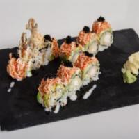 Rapunzel Hair Roll · Shrimp tempura inside, topped with avocado, spicy crab, eel sauce and yummy yummy sauce.