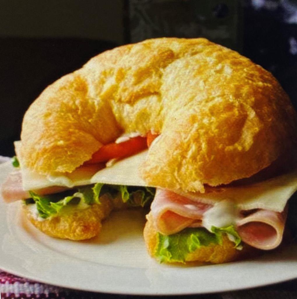 Artisan Ham & Swiss Croissant Sandwich · Sliced ham, swiss cheese,  spinach & mayo