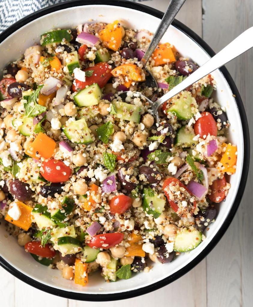 Mediterranean Feta Chicken Quinoa Bowl · Sliced grilled chicken, chickpea salad, mixed greens, feta cheese and cherry tomatoes on a bed of organic quinoa with vinaigrette dressing.