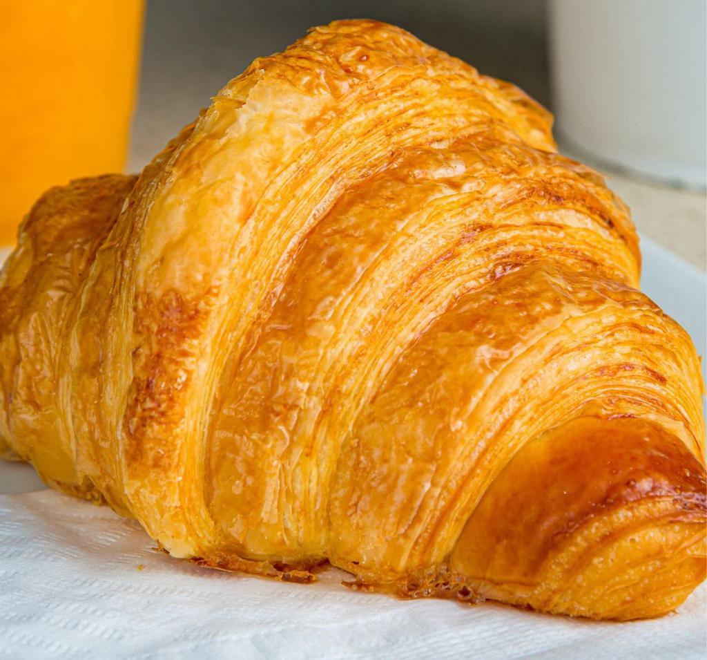 Plain Croissant · A rich, buttery, crescent-shaped roll of leavened dough or puff paste.
