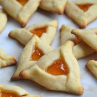 Apricot hamantaschen · A buttery shortbread crust folded around a dollop of tart apricot jam: these hamantaschen, o...