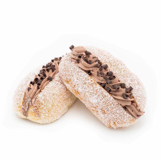 Chocolate Buttercream · A plump sweet bun, sliced open and filled with chocolate cream, sprinkled with coconut flakes and topped with charming chocolate shavings.