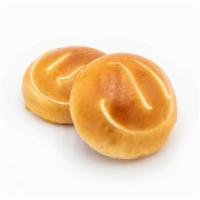 Custard Bun · A favorite of young and old alike, this soft egg bun hides a cool, creamy custard with a smo...