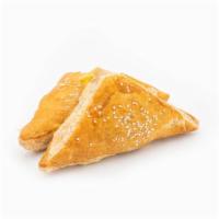Curry Chicken Puff · Hearty chicken smothered in curry sauce in a soft, flaky turnover-shaped pastry.
