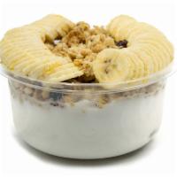Coco Coconut Bowl · Coconut bowl blend with raw coconut and coconut milk topped with granola, banana and honey.