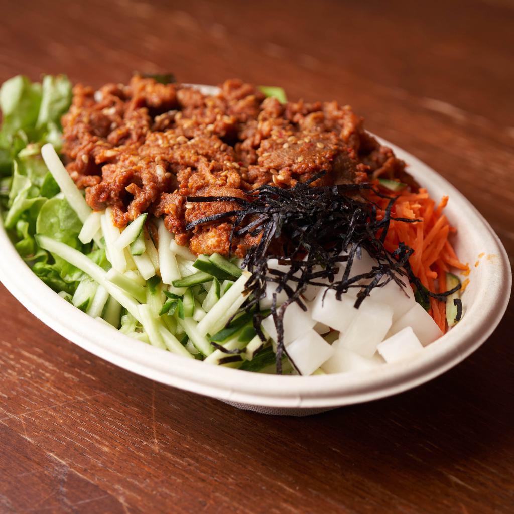 Spicy Pork Bowl · A generous, gluten-free bowl with grilled all-natural pork marinated in a spicy sauce, carrots, cucumbers, pickled radish, chopped red leaf lettuce, sesame oil seasoned rice, choice of protein, topped with sesame seeds, sesame oil, and shredded seaweed.