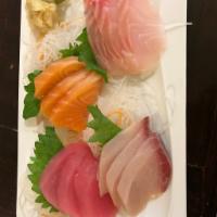 Sashimi Assorted · 3 salmon, 3 tuna, 3 yellowtail and 2 white fish.
