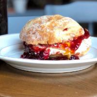 The Jammy Sammy · Fried egg, goat cheese, triple berry jam and arugula on a bianca roll.