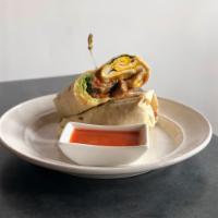 The Breakfast Wrap · 2 scrambled eggs, avocado, pepper-Jack cheese, tomato and spinach in an herb wrap.