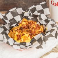Loaded Tots · Comes with bacon and cheddar cheese on with sour cream on the side.