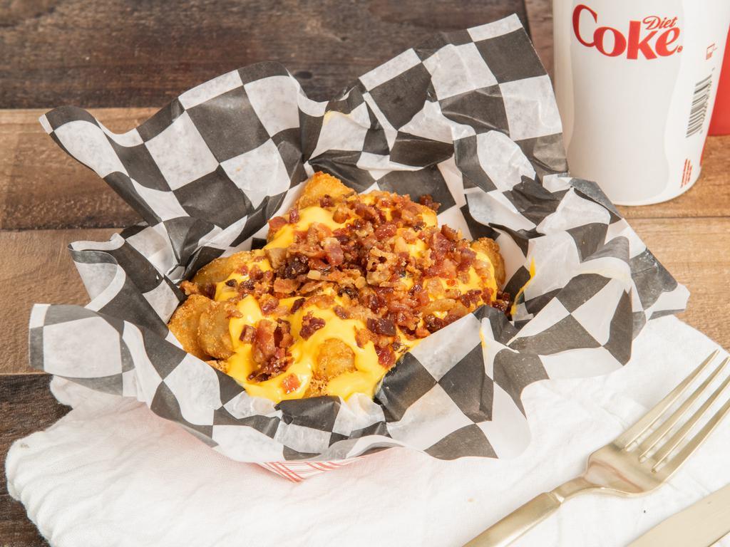 Loaded Tots · Comes with bacon and cheddar cheese on with sour cream on the side.