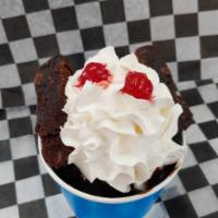Brownie Sundae · Made with vanilla soft serve ice cream, one gooey brownie topped with hot fudge, whipped cre...