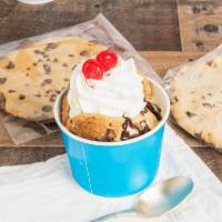 Cookie Sundae · Made with vanilla soft serve ice cream, two chocolate chip cookies, hot fudge, whipped cream...