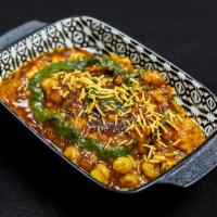 Aloo Tikki Chaat · Spiced potato patty served with spicy chickpeas, layered with tamarind, mint and yoghurt chu...