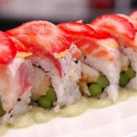 Reggae Roll · Shrimp, crab, mango and topped with avocado and strawberry with sweet sauce.