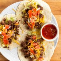 Beef Taco · 3 beef tacos served with lettuce, tomato, onion, picante sauce and shredded cheese.