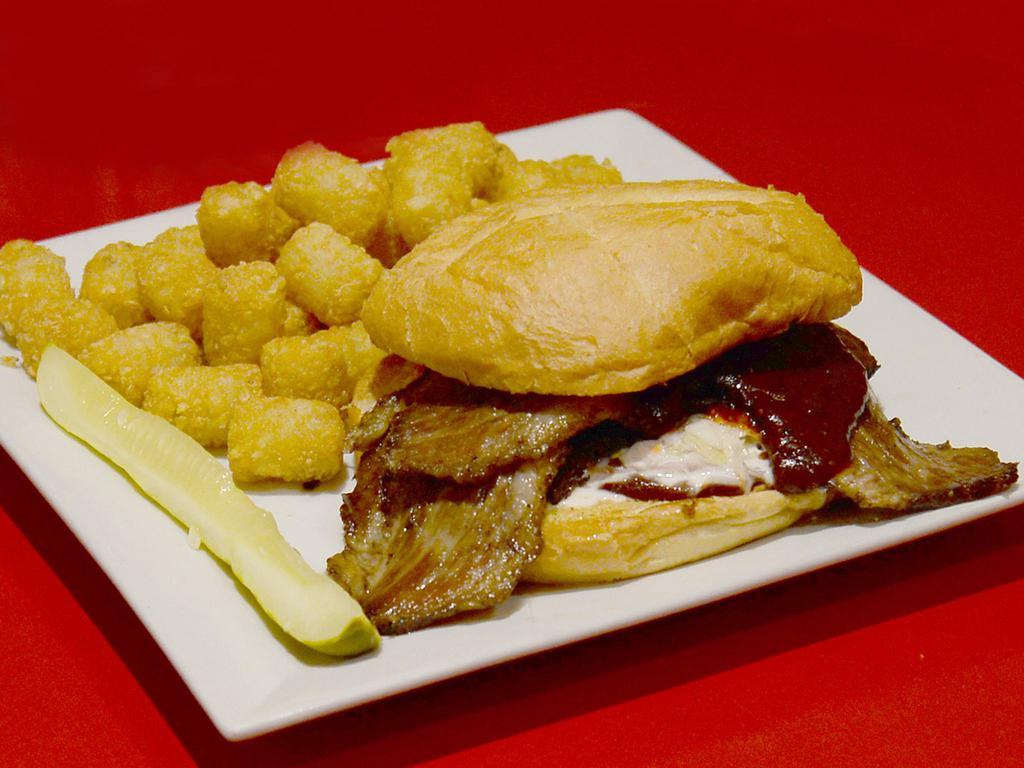 Brisket Sandwich · Served on a fresh kaiser roll with barbecue sauce, & coleslaw. Served with a pickle and your choice of side: waffle fries, fries, tater tots, coleslaw or potato salad