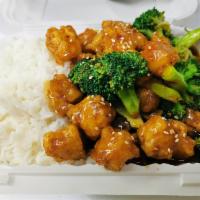 Sesame Chicken · Served with white rice. Made with write meat.