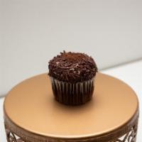 Triple Chocolate Cupcake · Chocolate Cupcake with Chocolate Buttercream rolled in Chocolate Sprinkles and topped with C...
