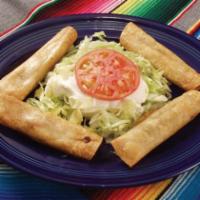 Taquitos Mexicanos · 4 taquitos, 2 shredded beef and 2 shredded chicken serve with lettuce, shredded cheese, guac...