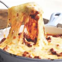 Chori Queso · Melted cheese casserole with Mexican sausage.