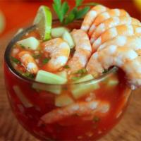 Cocktail de Camarones · Cold cooked shrimps with fresh orange and lime juice, tomato cocktail sauce, hot sauce, onio...
