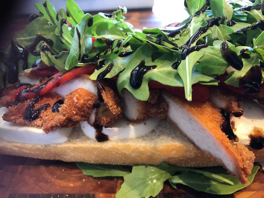 Chicken Milanese Sandwich · Bell and Evans, breaded chicken breast, house made, burrata, roasted peppers,balsamic glaze, arugula.