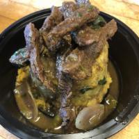 Mofongo with Pepper Steak · Mofongo topped with Pepper steak 