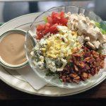 Cobb Salad  · Chicken breast, egg, bacon, greens, crumbled blue cheese and tomato.