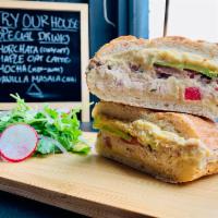 The Grand Tuna · Tuna salad, hummus, avocado on a ciabatta bread, and mix green salad.