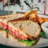 Perfect BLT · Crispy bacon, fresh tomato, lettuce, and garlic dressing on a everything sourdough bread.