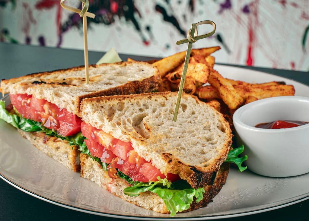 Perfect BLT · Crispy bacon, fresh tomato, lettuce, and garlic dressing on a everything sourdough bread.
