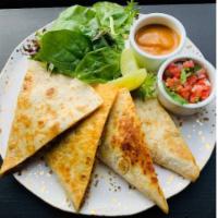 Giant Quesadilla · Monterey Jack, Cheddar, Asadero and quesadilla cheese, spicy salsa, and pico de gallo on flo...