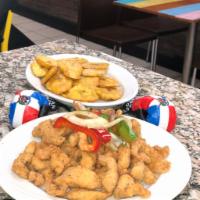 Chicharron de Pollo · Con o sin hueso. Fried chicken chunks (with or without bones).