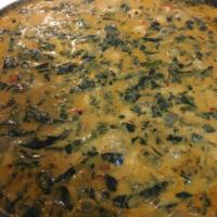 Creamed Spinach · Coconut curry spinach with chick peas, tomato and spices over brown rice.