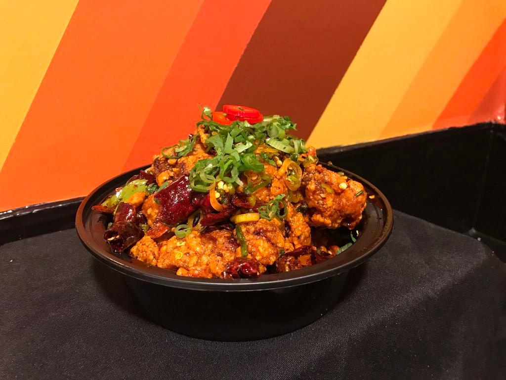 VEGETARIAN Mala Popcorn Chicken  · Tempura-battered fried vegetarian chicken, tossed in house chili oil with Sichuan spice mix and cilantro/scallion. With house-made aromatic soy sauce. 