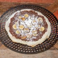 Chunky Monkey Pie · Nutella, bananas, drizzled fresh chocolate topped with powdered sugar.