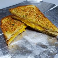 Bluff Grilled (Grilled Cheese) · 4 slices of American Cheese on Potato Bread