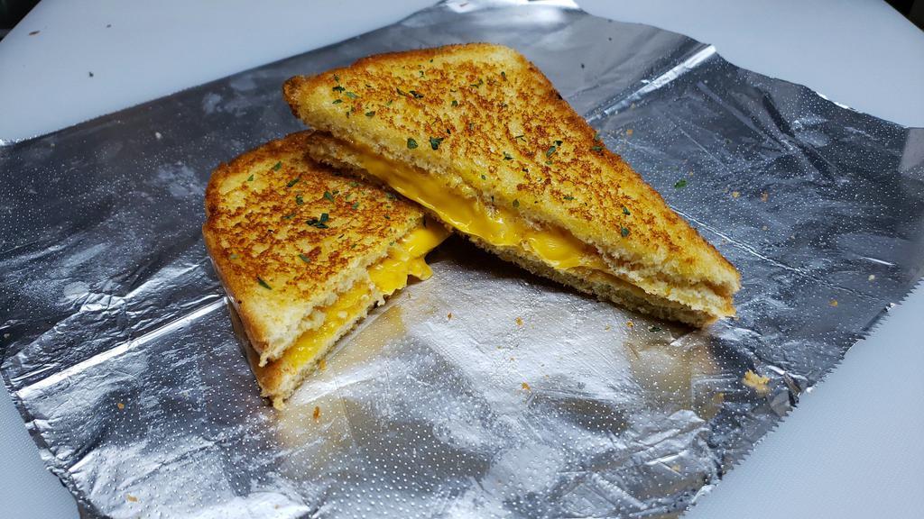Bluff Grilled (Grilled Cheese) · 4 slices of American Cheese on Potato Bread