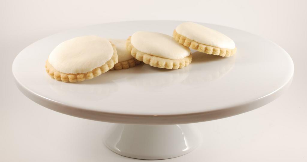 Vanilla Creme Cookies · Delicious, individually wrapped signature vanilla cookies with buttercream vanilla frosting. Made with reading Alaska made vanilla bean extract.  No fake vanilla flavoring here, only the best ingredients.  Each cookie individually wrapped.