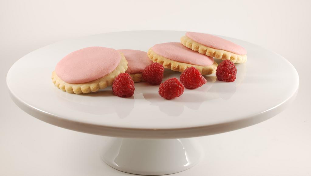 Raspberry Creme Cookie · Image raspberries freshly picked.  Well, that’s what our cookies taste like, but we replaced the thorns with sugar cookies. Our buttercream frosting is a melt in your mouth raspberry shot of deliciousness.
